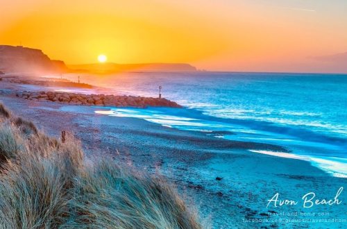 Dorset UK United Kingdom Avon beach in Christchurch sunset sea mountain ocean