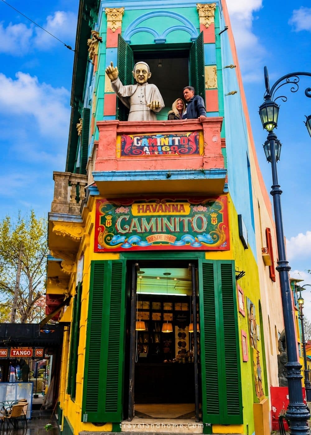Arina and her husband on a balcony at Caminito Street in La Boca, Buenos Aires