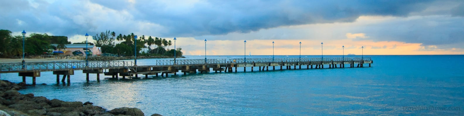 Barbados, Speightstown pier, dream of the perfect tropical beach - cliffs, coconut palms, a cave, white sand, brisk breezes and Turquoise Sea