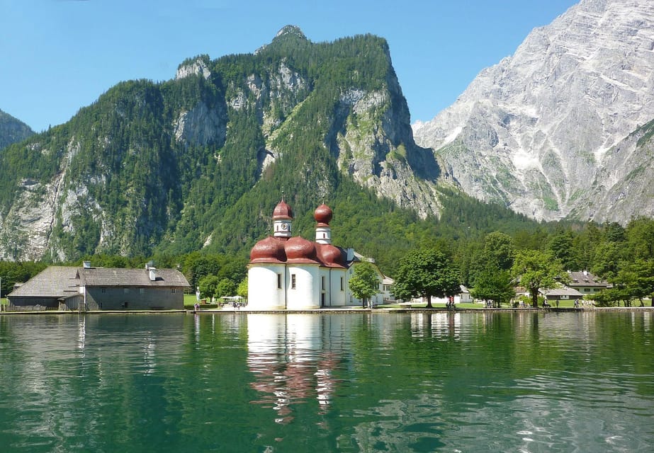 natural beauty of Königsee Lake on an unforgettable boat tour to St. Bartolome, where you can take in breathtaking views of the surrounding mountains and lush forests.