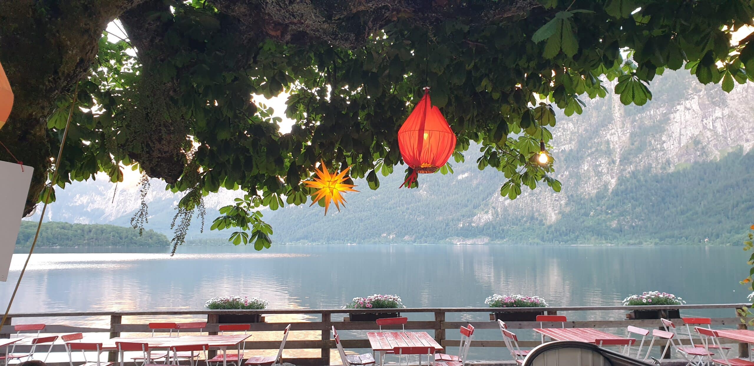 beautiful lakeside restaurant in Hallstatt Austria - at night with lanterns