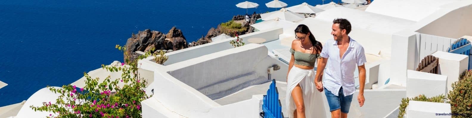 Where to stay in Greece, happy couple in Santorini