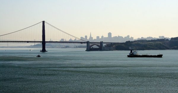 A view from Sausalito A view from Sausalito over the San Francisco Bridge, and San Francisco with a boat sailing in the foreground